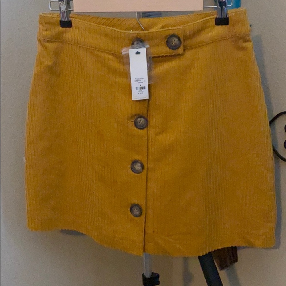 A mustard colored skirt.